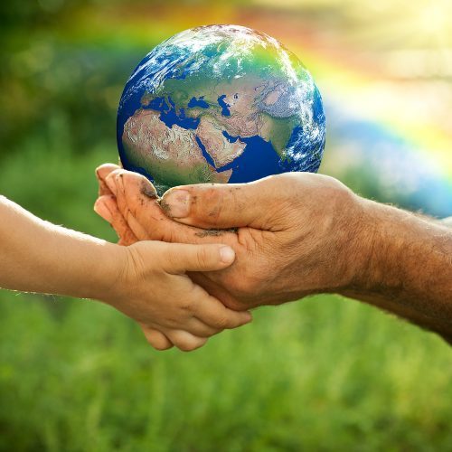 hand holding planet Earth