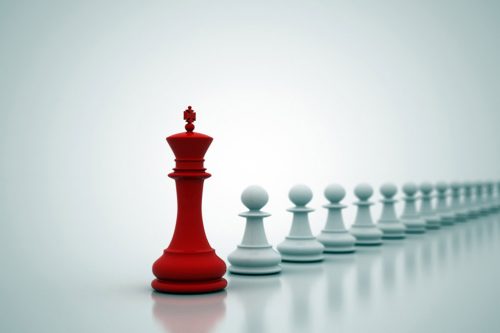 Chess king leading pawns